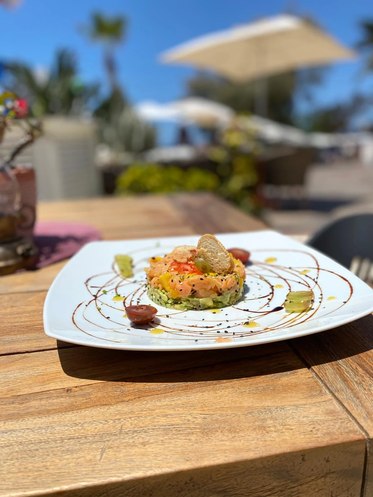 Salmon and avocado tartare served on a white plate on the Eulenspiegel Tenerife terrace